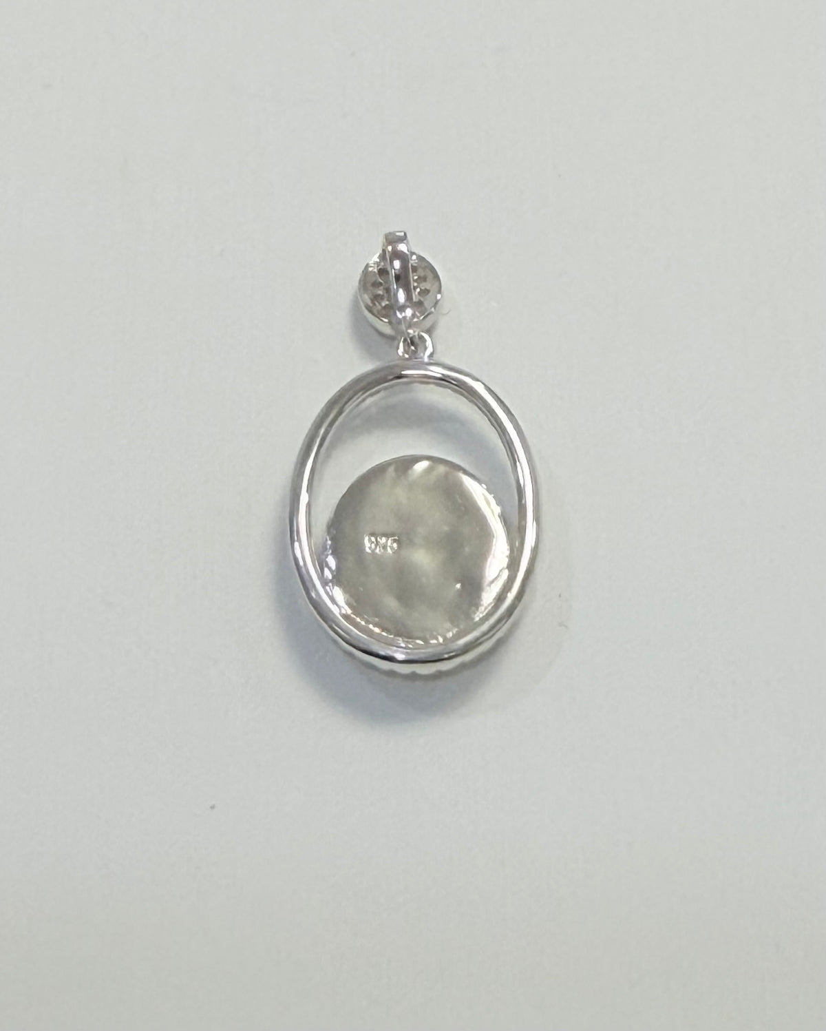 S914- .925 Sterling Silver Oval Larimar Pendant W.G