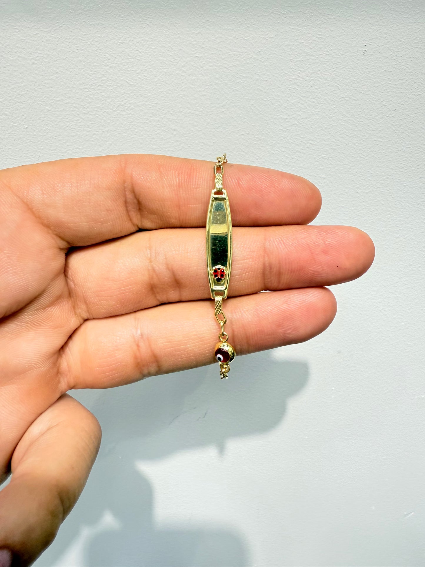 472- NEW 14K Hollow Red Evil Eye & Dolphin ID Bracelet (2.75mm) W.G