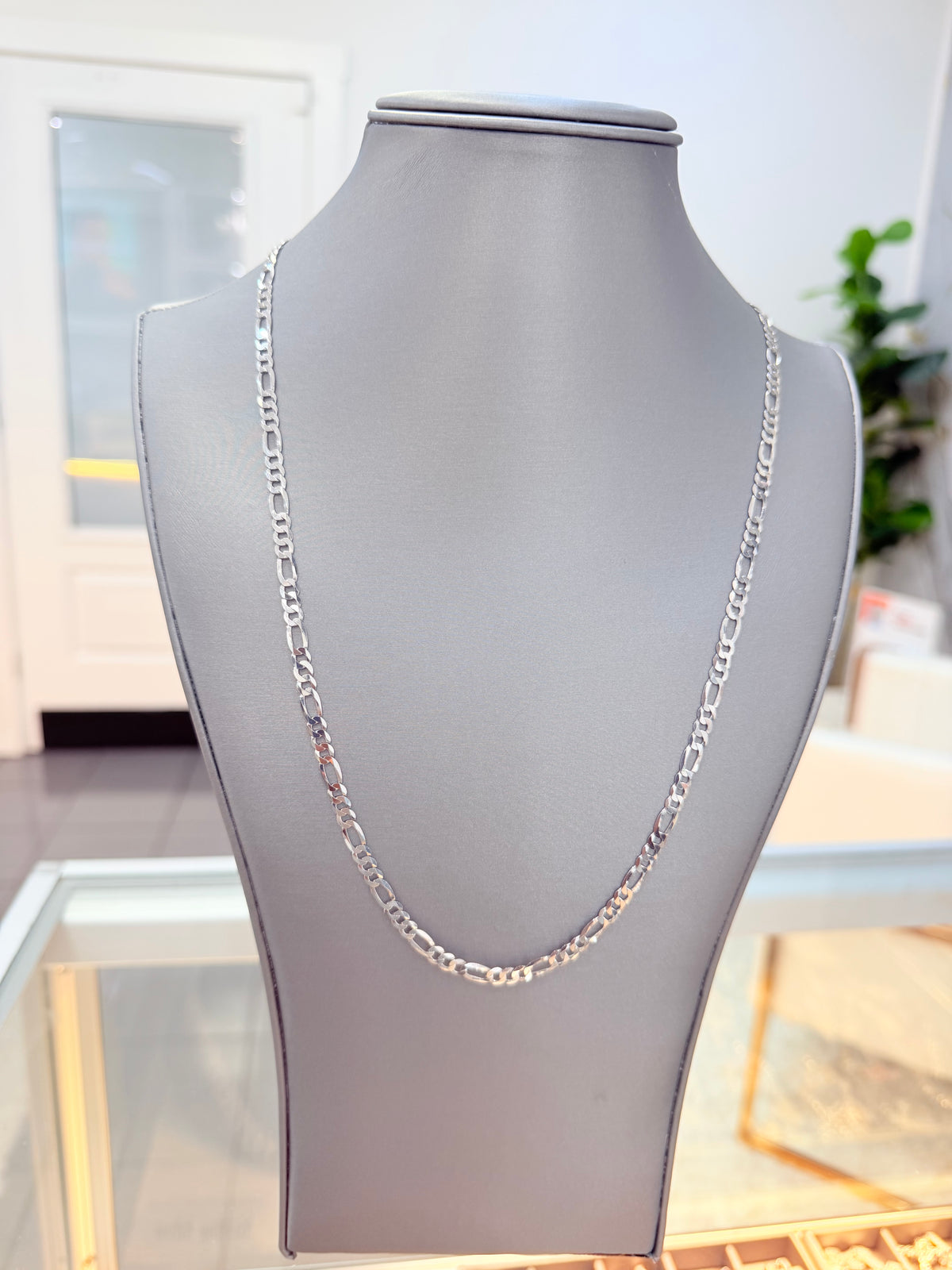 S917- .925 Sterling Silver Figaro Chain 22” (4.4mm) W.G
