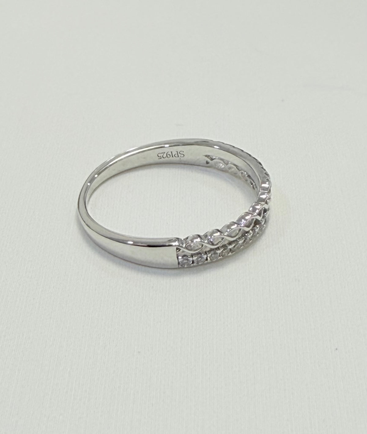 S446- NEW .925 Sterling Silver Micro Eternity CZ Ring W.G