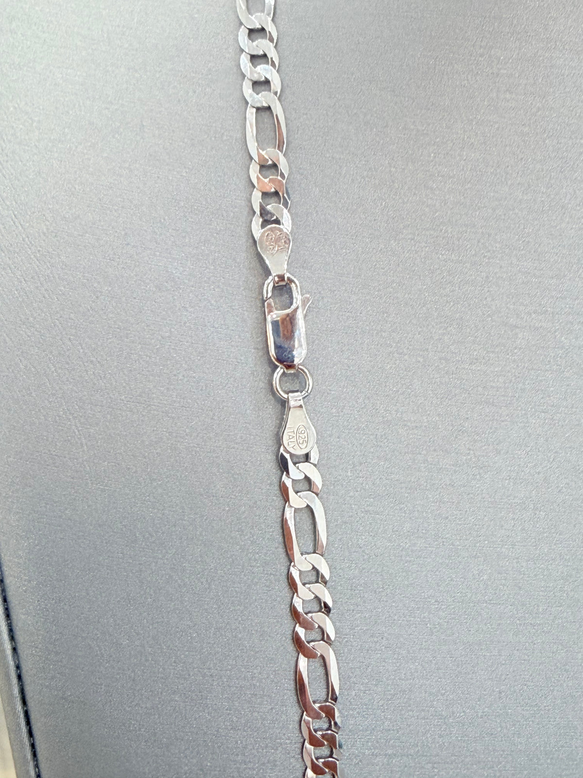 S917- .925 Sterling Silver Figaro Chain 22” (4.4mm) W.G