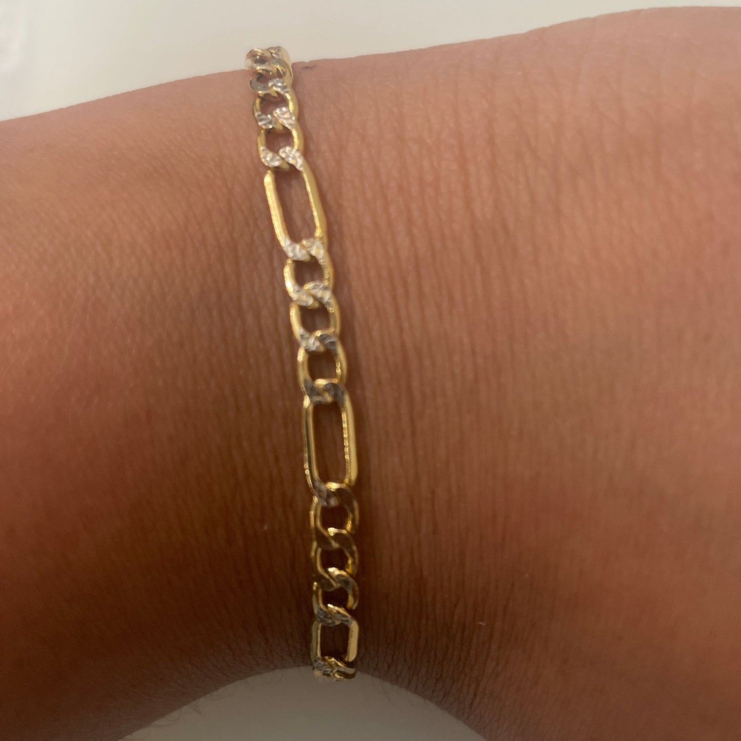 721- Two Toned Gold Figaro Bracelet 7”